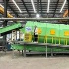 Macchina per lo screening a tamburo per il sistema automatico di smistamento dei solidi all'interno di un impianto di smistamento dei rifiuti